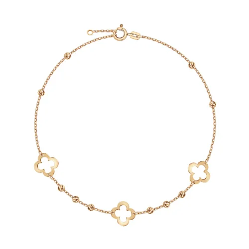 Delikatna złota bransoletka ozdobiona koniczynami